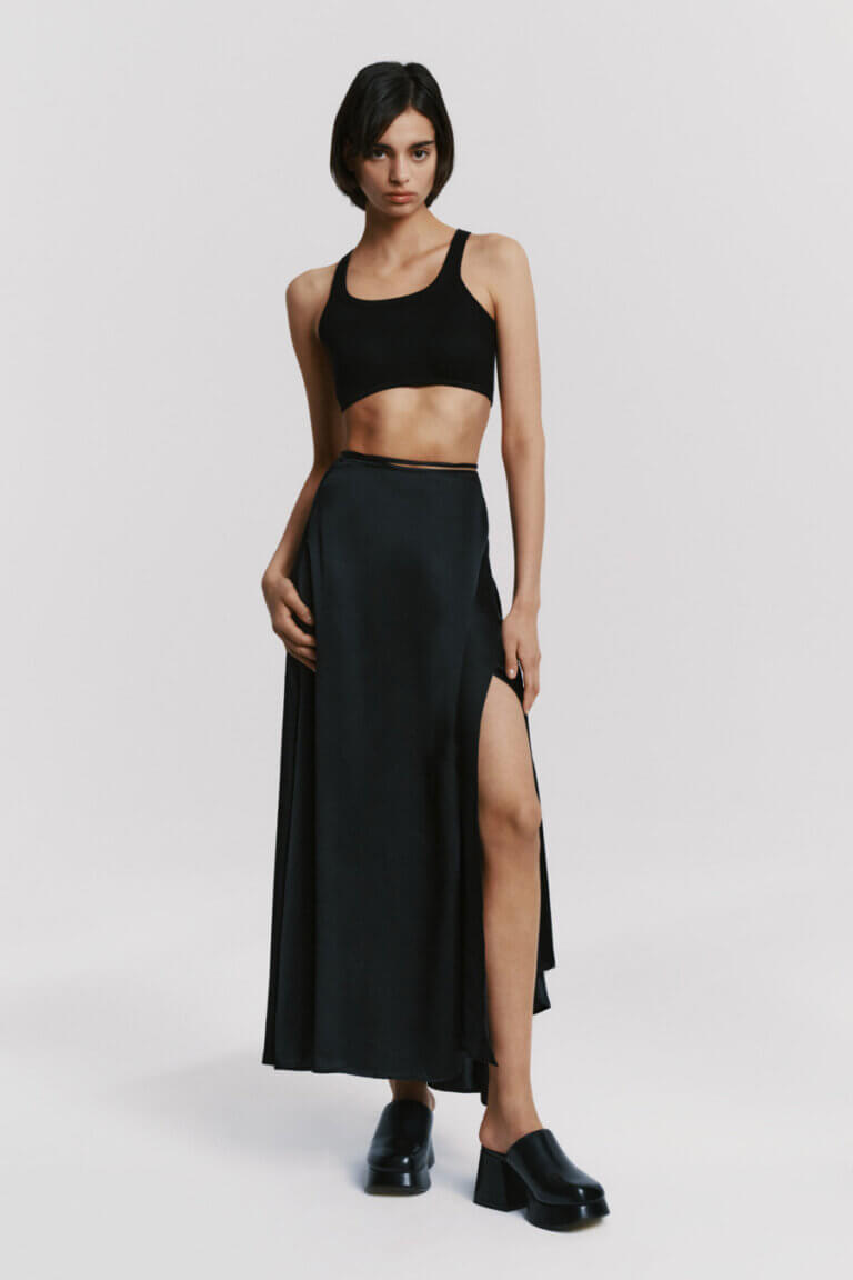 Atthrea's elegant black silk maxi wrap skirt with high waist and sensual leg slit