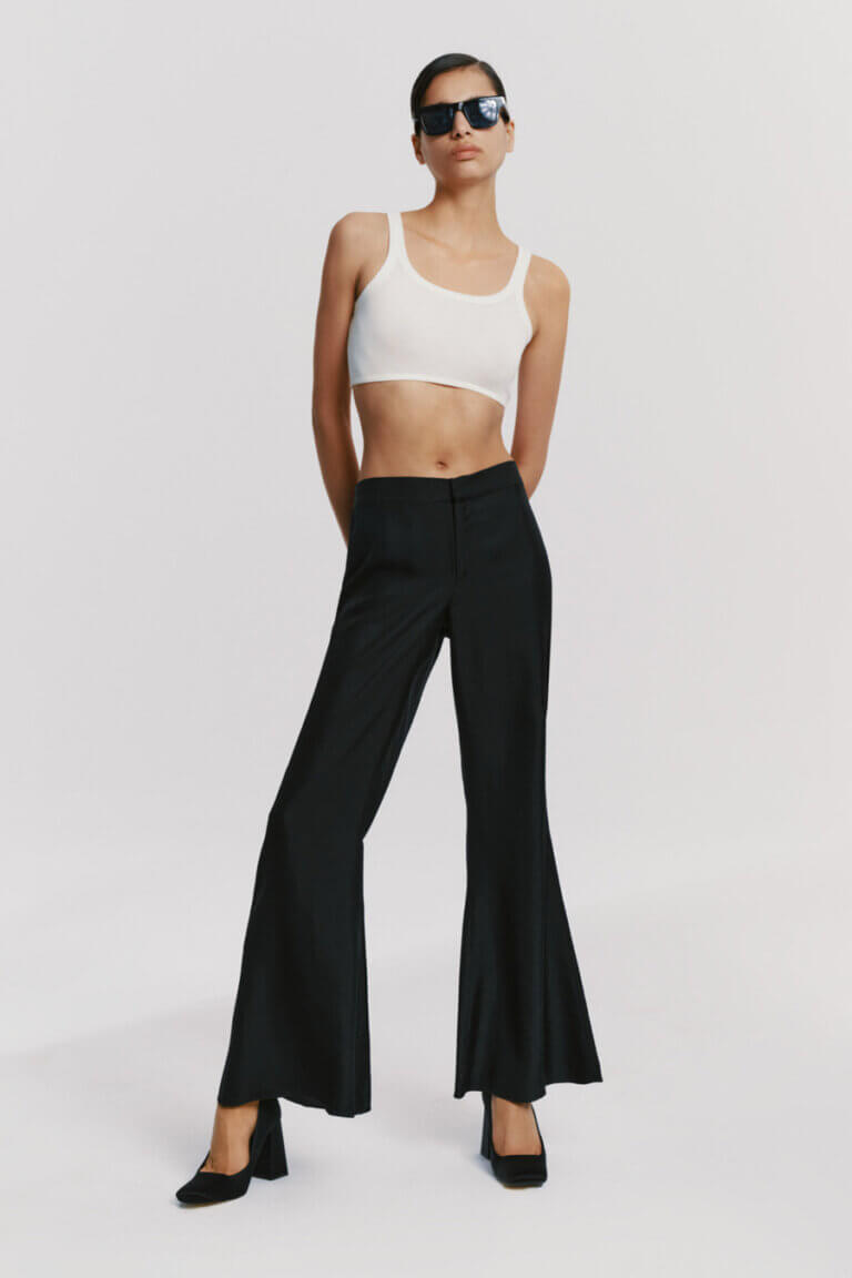 Silk black trousers styled with white silk crop top